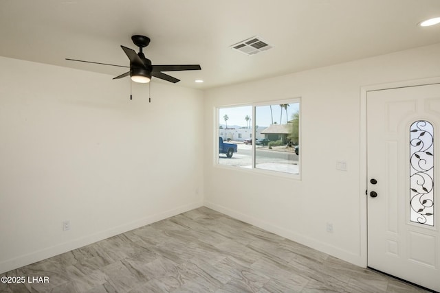 foyer featuring a ceiling fan, recessed lighting, visible vents, and baseboards