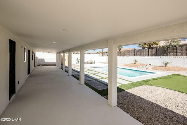 exterior space featuring a fenced backyard and a fenced in pool