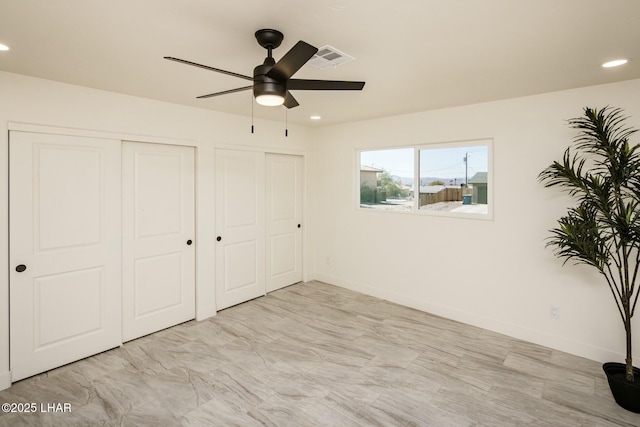 unfurnished bedroom featuring ceiling fan, recessed lighting, visible vents, baseboards, and two closets