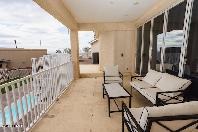 balcony featuring central AC unit and an outdoor hangout area