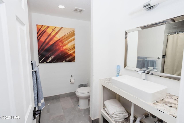 full bathroom with recessed lighting, toilet, baseboards, and visible vents