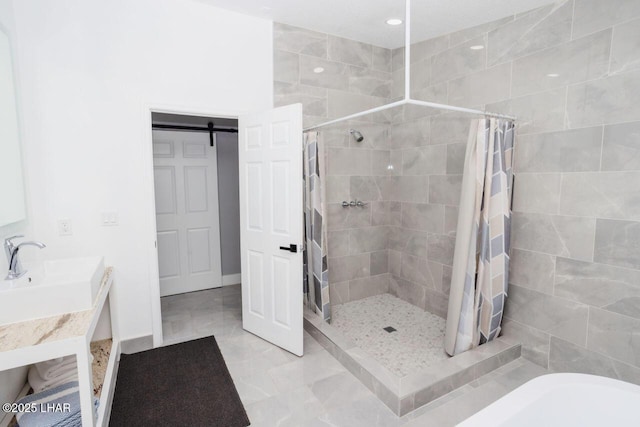 bathroom with tiled shower