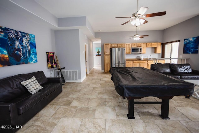 living room featuring pool table, baseboards, visible vents, and ceiling fan