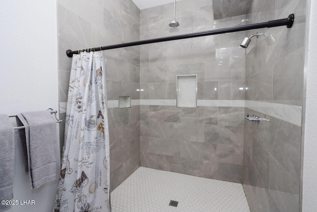 bathroom featuring a shower stall