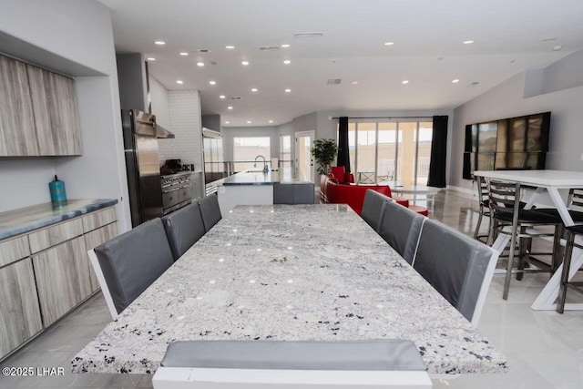 dining space featuring recessed lighting, visible vents, and lofted ceiling