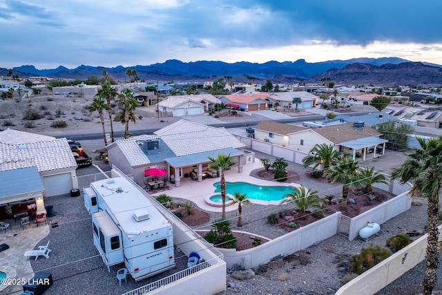 birds eye view of property with a mountain view