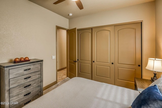 bedroom with ceiling fan and a closet