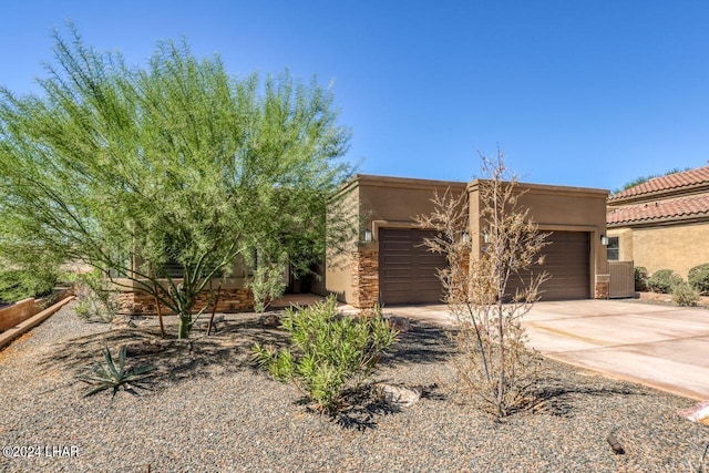 adobe home featuring a garage