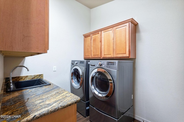 2555 Avalon Ln, Lake Havasu City, AZ 86404 - laundry room featuring cabinet space, washing machine and clothes dryer, dark wood-type flooring, and baseboards