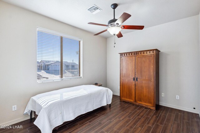 2555 Avalon Ln, Lake Havasu City, AZ 86404 - bedroom with dark wood-type flooring, baseboards, and ceiling fan