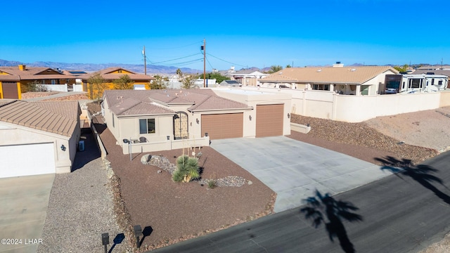 2555 Avalon Ln, Lake Havasu City, AZ 86404 - single story home featuring a residential view, driveway, an attached garage, and fence