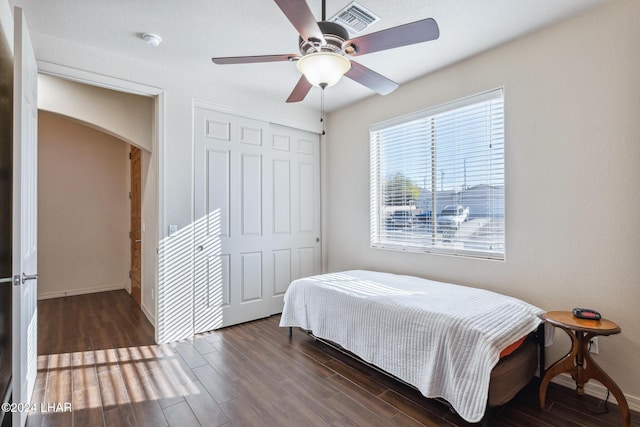 2555 Avalon Ln, Lake Havasu City, AZ 86404 - bedroom with arched walkways, a closet, wood finished floors, and baseboards