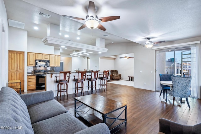 2555 Avalon Ln, Lake Havasu City, AZ 86404 - living room with ceiling fan, dark wood finished floors, and baseboards