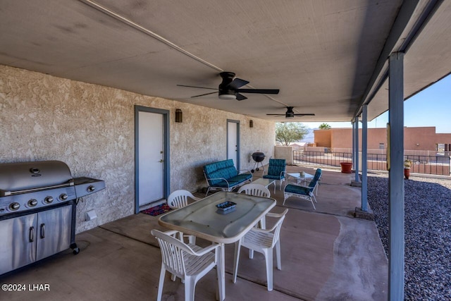 view of patio with area for grilling and ceiling fan