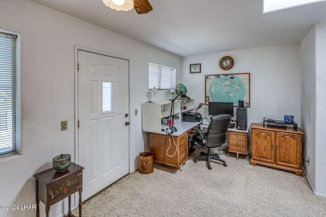 office featuring light carpet, plenty of natural light, and ceiling fan