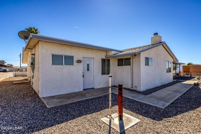 back of house featuring a patio