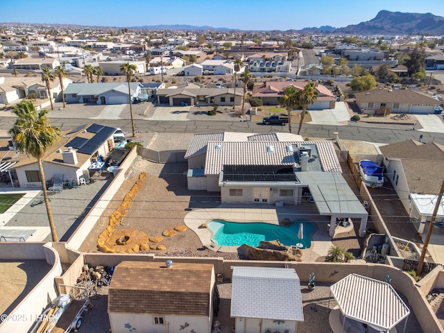 birds eye view of property featuring a mountain view