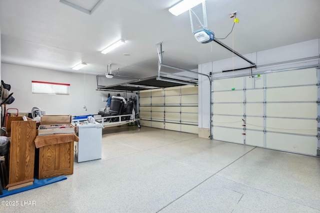 garage with refrigerator and a garage door opener