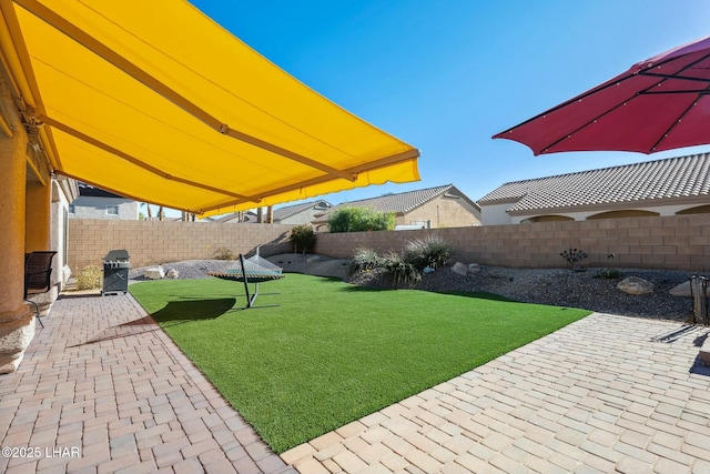 view of yard featuring a fenced backyard and a patio
