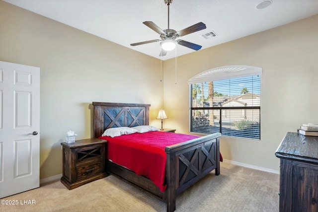 bedroom featuring baseboards, a ceiling fan, visible vents, and carpet floors
