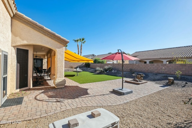view of patio / terrace featuring a ceiling fan and a fenced backyard