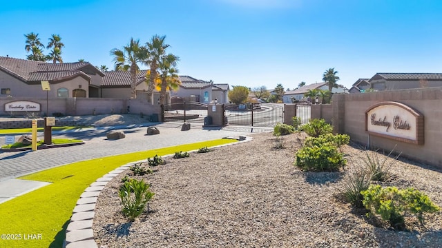 view of yard featuring a gate, a residential view, and fence