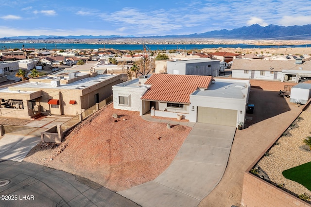 birds eye view of property featuring a mountain view