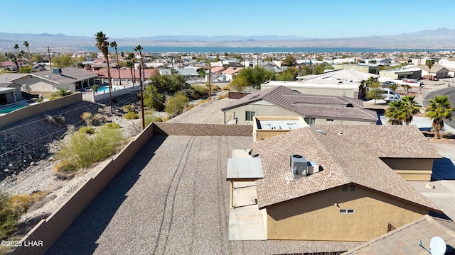 drone / aerial view featuring a residential view and a mountain view