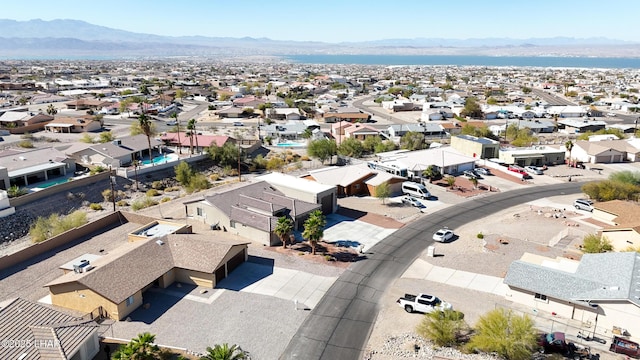 drone / aerial view featuring a residential view and a mountain view