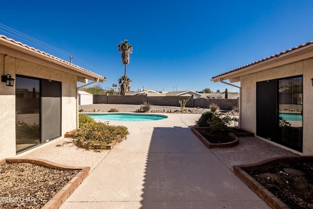 view of swimming pool featuring a patio