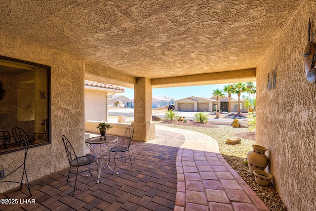 view of patio / terrace with a garage