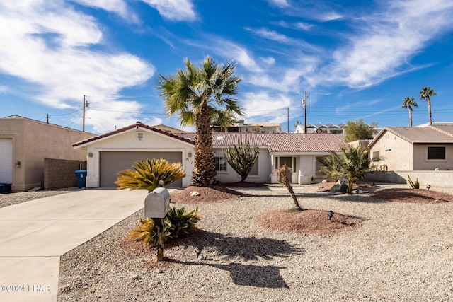 ranch-style house featuring a garage