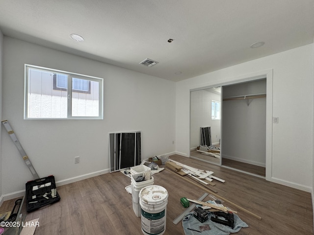 31567 94th St, Parker, AZ 85344 - unfurnished bedroom featuring wood finished floors, baseboards, and a closet