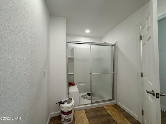 31567 94th St, Parker, AZ 85344 - bathroom with wood finished floors, a stall shower, baseboards, and recessed lighting