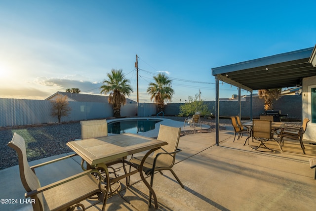 view of patio with a fenced in pool