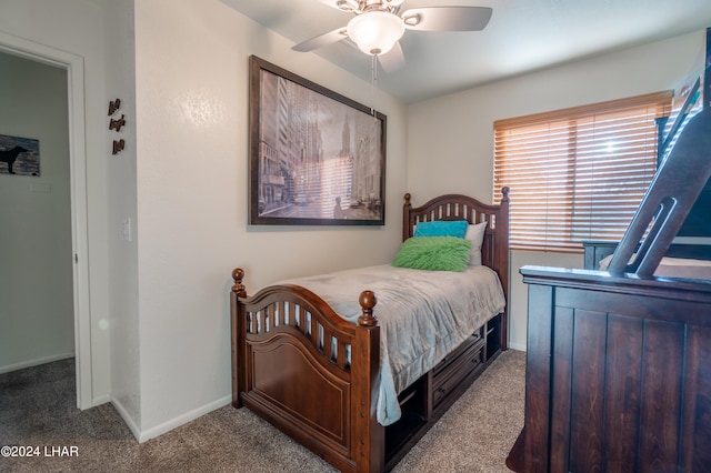 bedroom featuring light colored carpet and ceiling fan