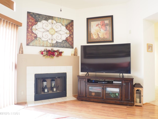 1650 S Smoketree Ave Unit 168, Lake Havasu City, AZ 86403 - living room with wood finished floors and a tiled fireplace