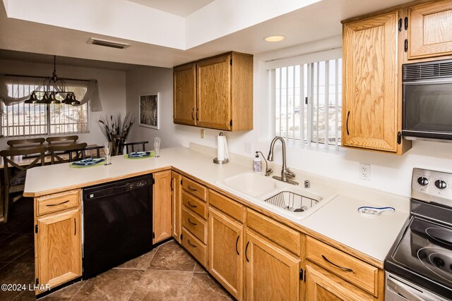 kitchen featuring sink, a chandelier, hanging light fixtures, stainless steel electric range, and dishwasher