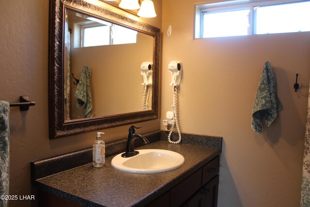 bathroom with a wealth of natural light and vanity