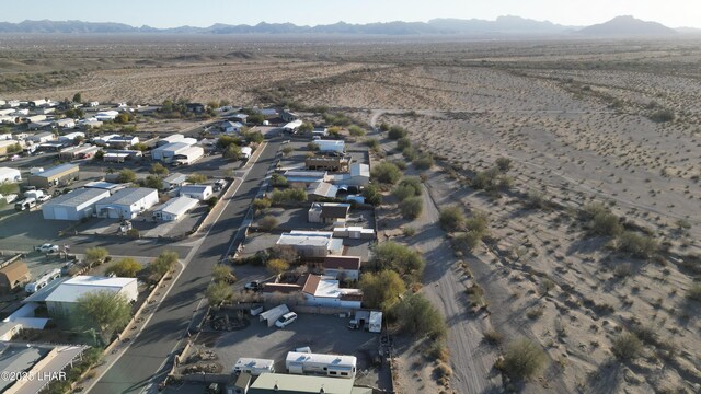 drone / aerial view featuring a residential view and a mountain view