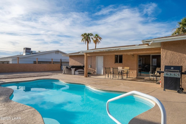 view of pool with a patio and area for grilling