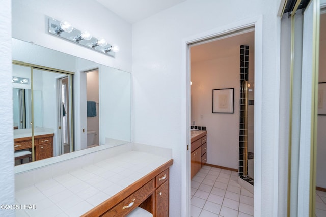 bathroom with tile patterned floors, toilet, and vanity