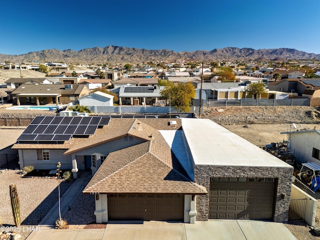 birds eye view of property with a mountain view