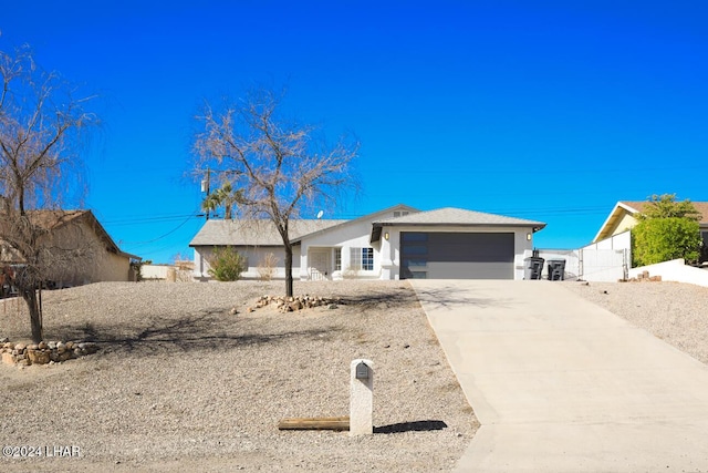 single story home featuring a garage