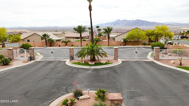view of street featuring a gated entry, a residential view, and a gate