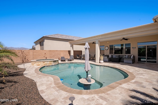 view of swimming pool featuring a patio, an outdoor hangout area, a fenced backyard, ceiling fan, and a pool with connected hot tub