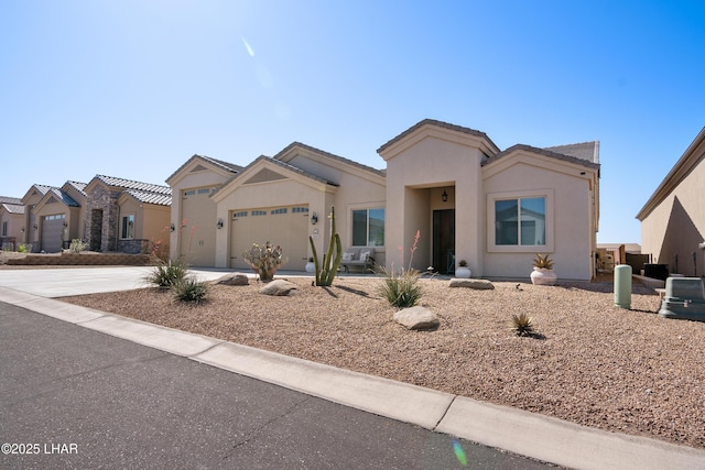 ranch-style home featuring an attached garage, driveway, stucco siding, and a tile roof