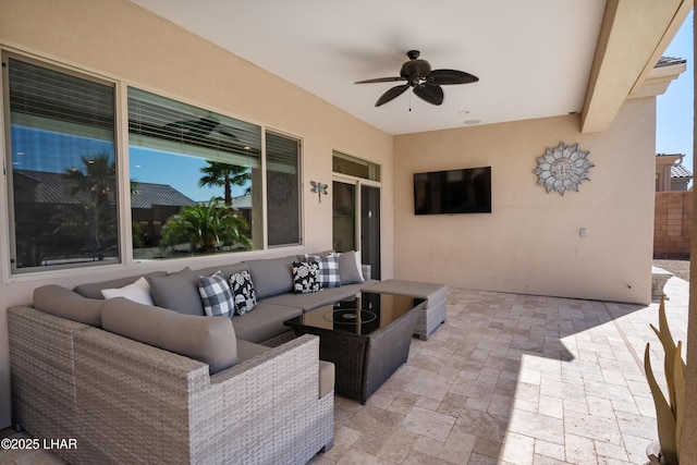 view of patio with outdoor lounge area and ceiling fan
