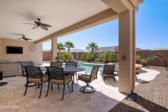 view of patio / terrace with a fenced in pool, outdoor dining space, a fenced backyard, an outdoor hangout area, and ceiling fan