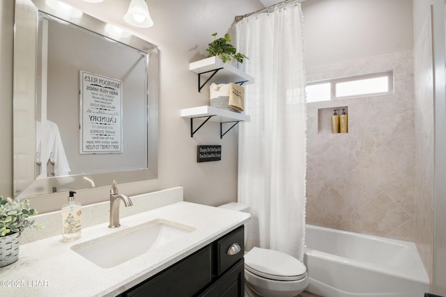 full bathroom featuring toilet, shower / bath combo, and vanity